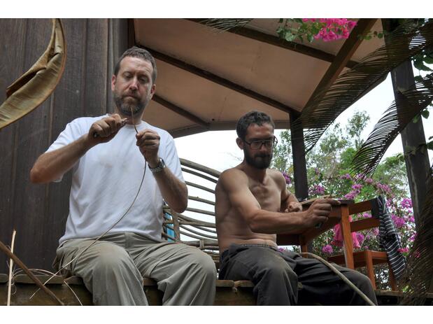 John Sullivan (left) and Joe Cutler (right) prepare worm skewers for mormyrid traps, Gabon 2014